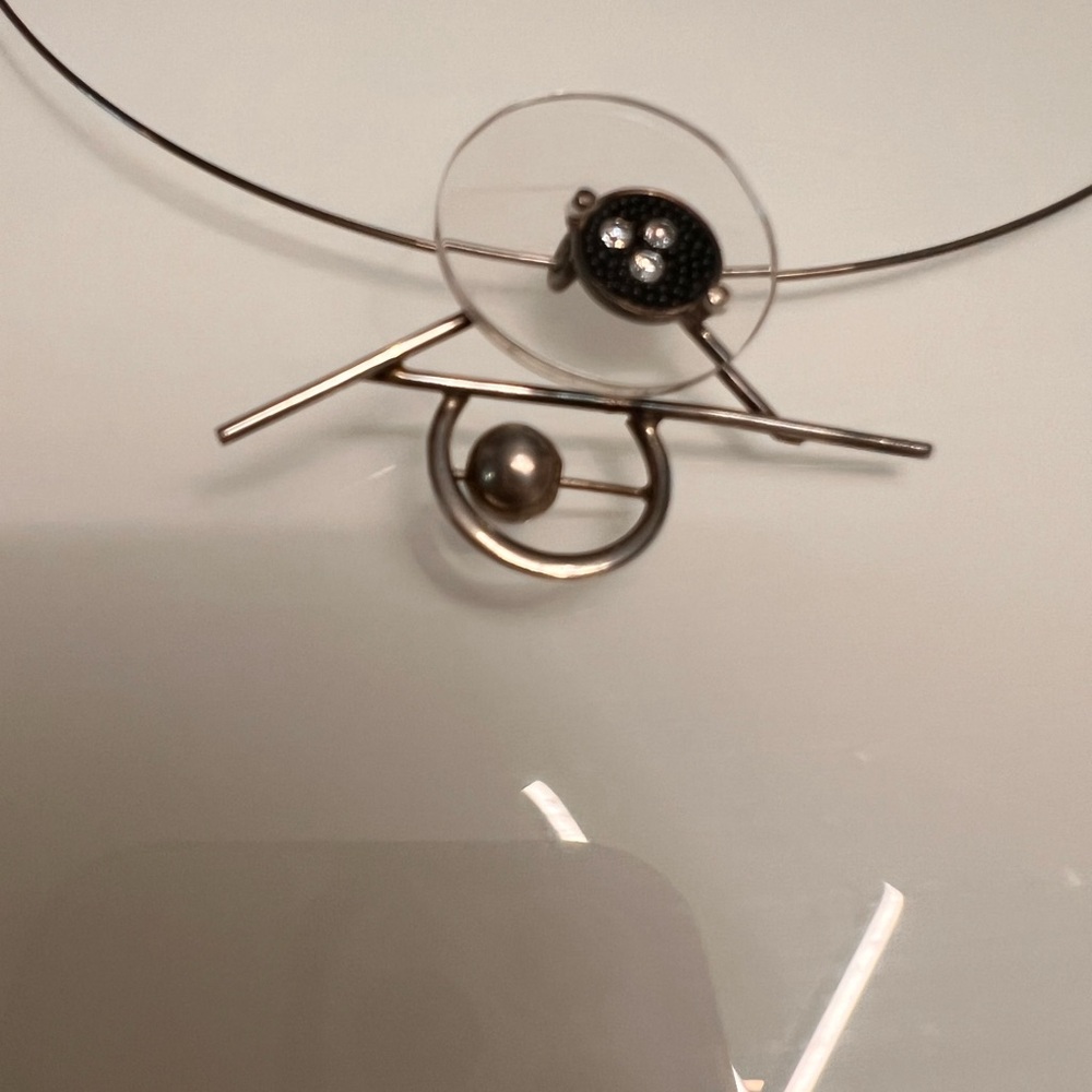 Alpaca silver, and crystal pendant on choker.